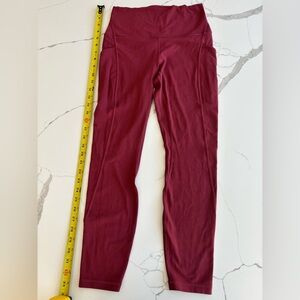 Lululemon invigorate HR tight with pockets worn twice,dark mauve/rust color